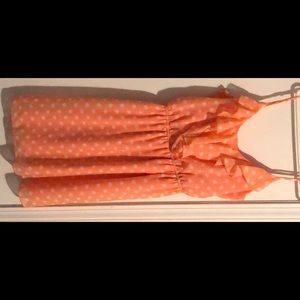 Peach colored polka dotted dress